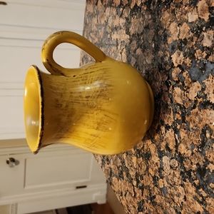 Yellow ceramic pitcher